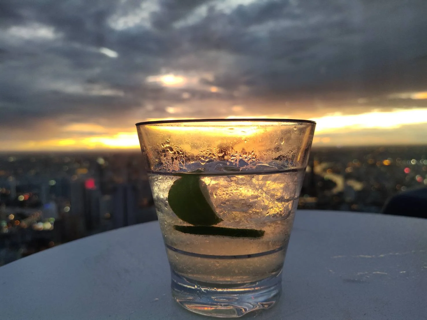 glass with drink during sunset on king power maha nakhon